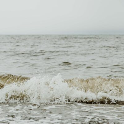 a large body of water with waves coming in to shore