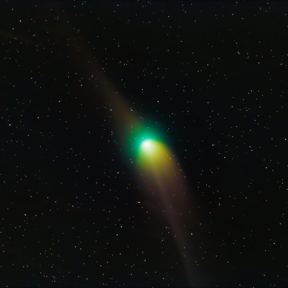 a bright green object in the middle of the night sky