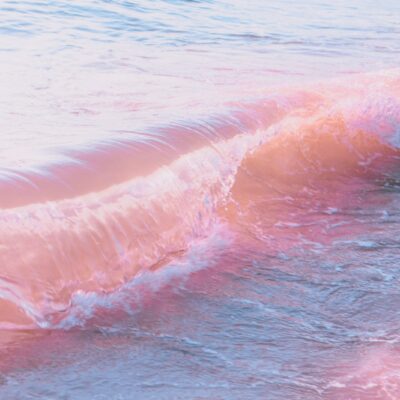 a person riding a surfboard on a wave in the ocean