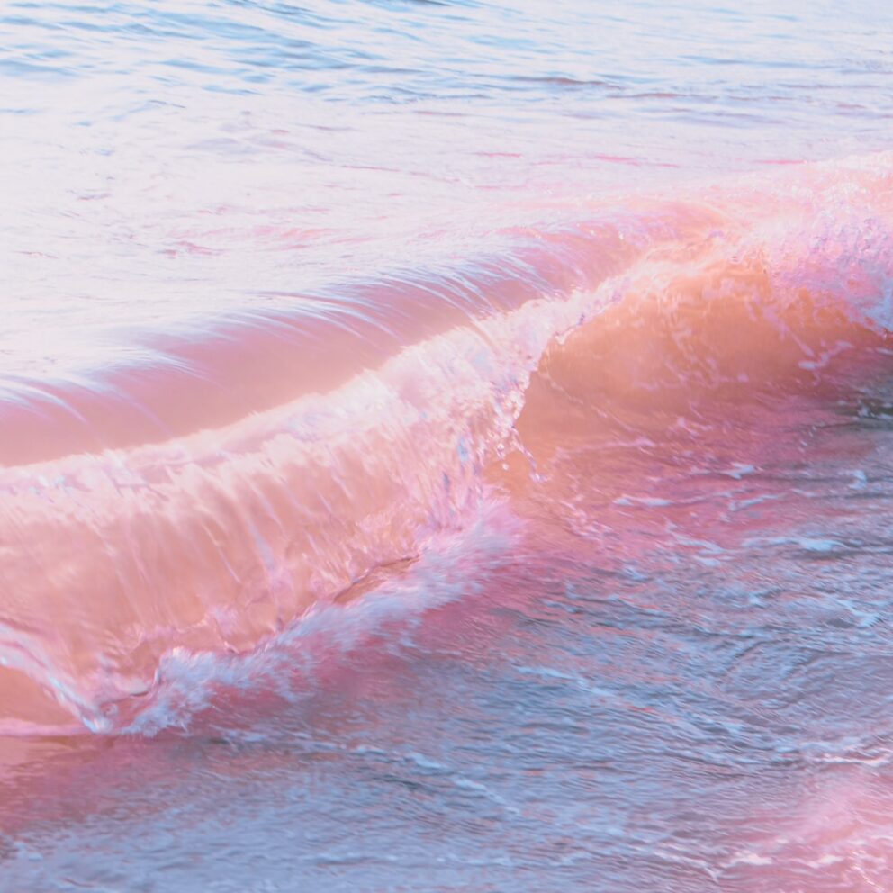 a person riding a surfboard on a wave in the ocean