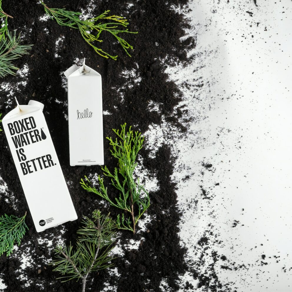 Boxed Water cartons on the black and white ground