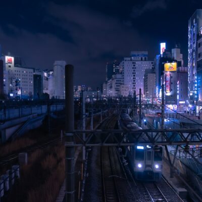 a train traveling through a city at night