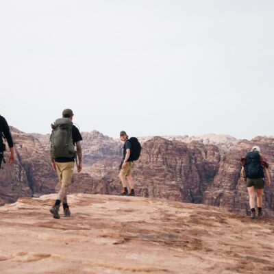 a group of people hiking up a mountain