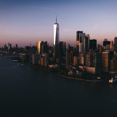 an aerial view of a city at sunset
